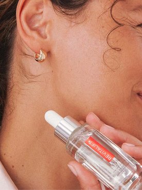 Person Holding Revitalift Hyaluronic Acid Serum
