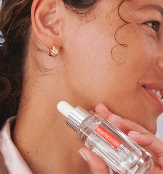 Person Holding Revitalift Hyaluronic Acid Serum