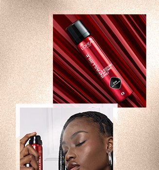 Woman applying setting spray to face